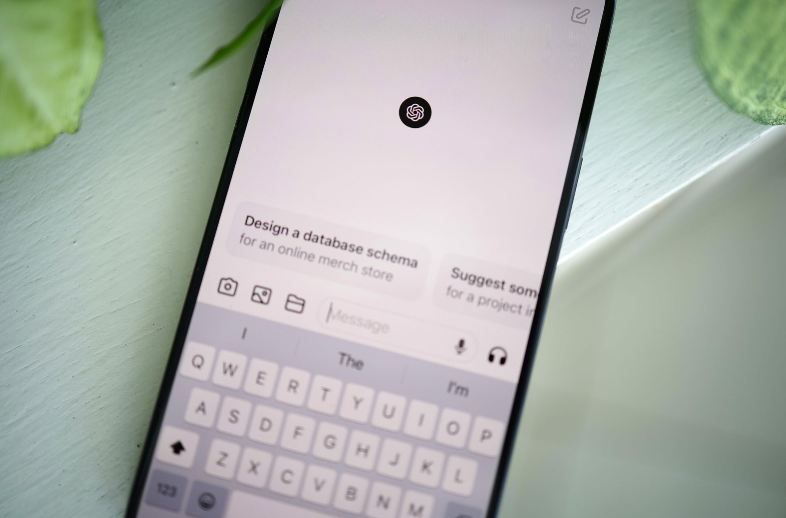 Smartphone displaying ChatGPT on a table